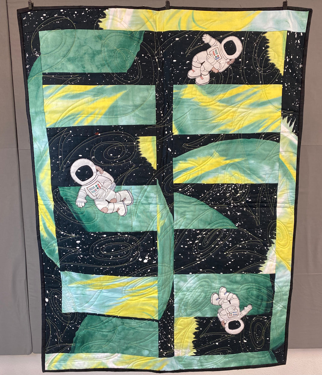 Finished Quilt - Astronauts on Green Background
